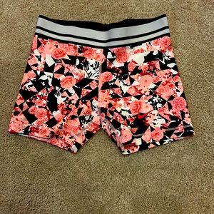 Pink floral Nike pros black and white striped waste band